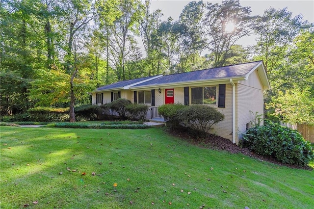 ranch-style home with a front yard