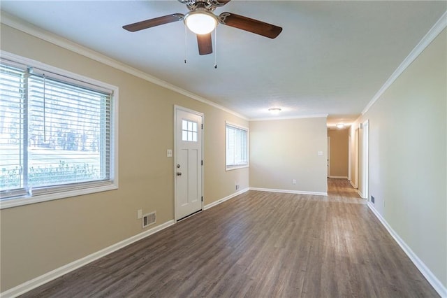 interior space with crown molding, ceiling fan, and dark wood-type flooring