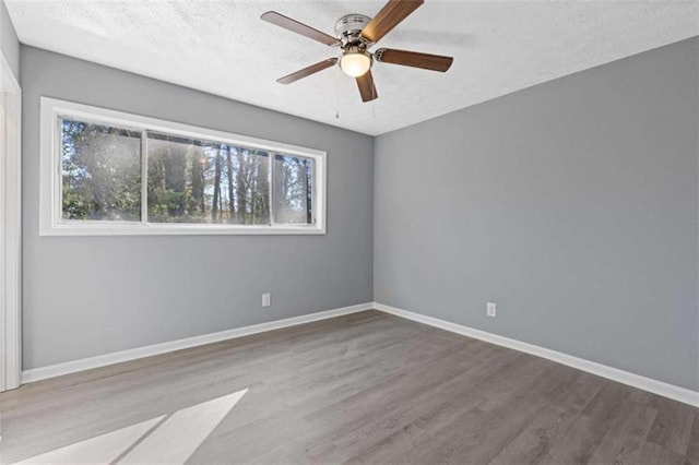 3236 Henderson Mill Rd Unit 5, Atlanta, GA 30341 - unfurnished room featuring wood finished floors, ceiling fan, and a textured ceiling