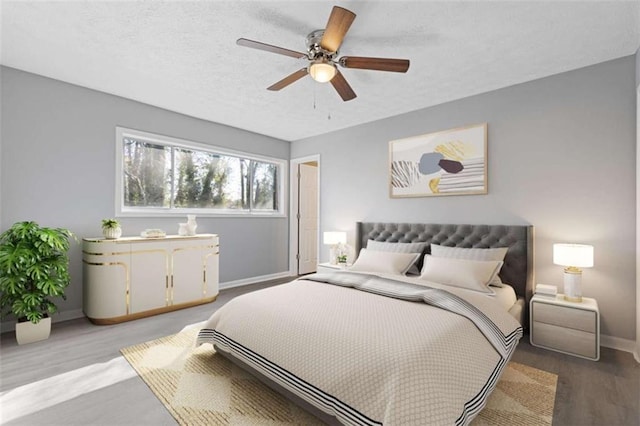 3236 Henderson Mill Rd Unit 5, Atlanta, GA 30341 - bedroom with wood finished floors, ceiling fan, and a textured ceiling
