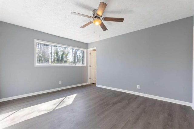3236 Henderson Mill Rd Unit 5, Atlanta, GA 30341 - unfurnished room with dark wood finished floors, a textured ceiling, and a ceiling fan