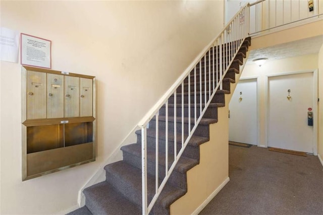 3236 Henderson Mill Rd Unit 5, Atlanta, GA 30341 - stairway featuring carpet floors and a towering ceiling
