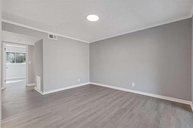 3236 Henderson Mill Rd Unit 5, Atlanta, GA 30341 - unfurnished room with wood finished floors and crown molding