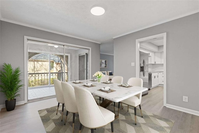 3236 Henderson Mill Rd Unit 5, Atlanta, GA 30341 - dining area featuring light wood-type flooring and ornamental molding