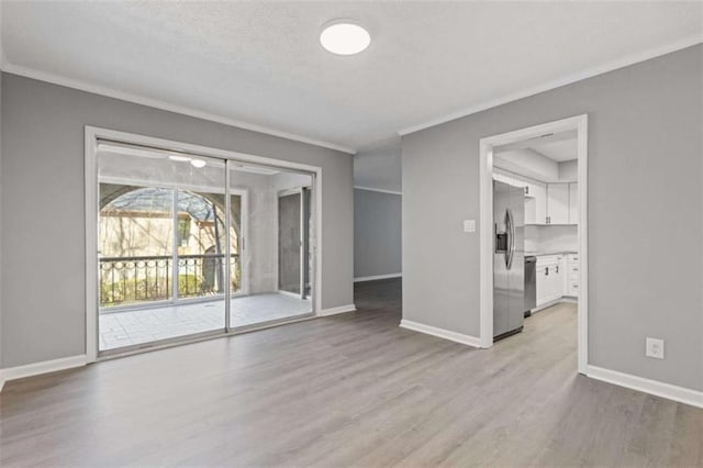 3236 Henderson Mill Rd Unit 5, Atlanta, GA 30341 - unfurnished living room featuring ornamental molding and light wood finished floors