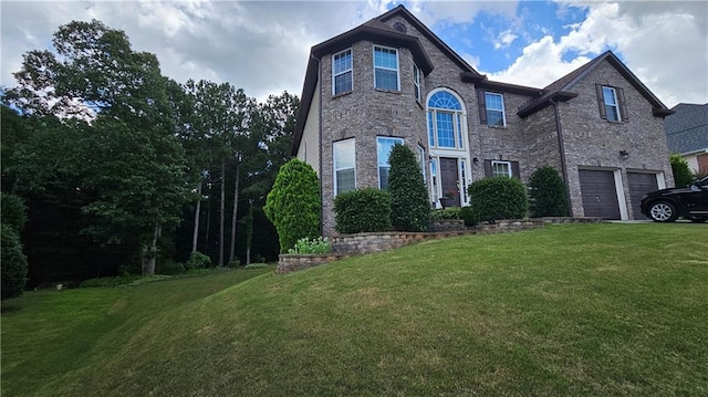 2819 Heritage Oaks Cir, Dacula, GA 30019 - traditional-style house featuring an attached garage and a front lawn