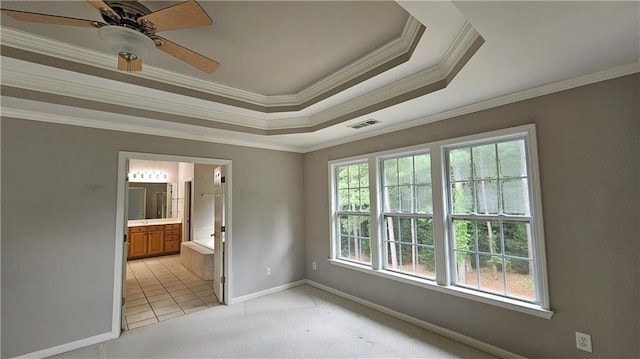 2819 Heritage Oaks Cir, Dacula, GA 30019 - unfurnished room featuring ornamental molding, light carpet, a ceiling fan, and a tray ceiling