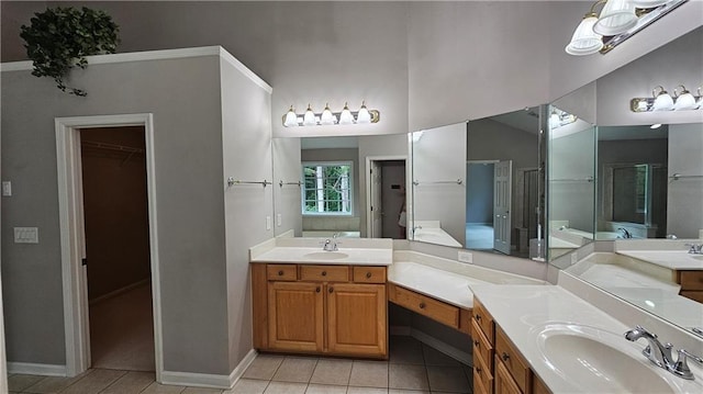2819 Heritage Oaks Cir, Dacula, GA 30019 - full bathroom featuring double vanity, tile patterned floors, and a walk in closet