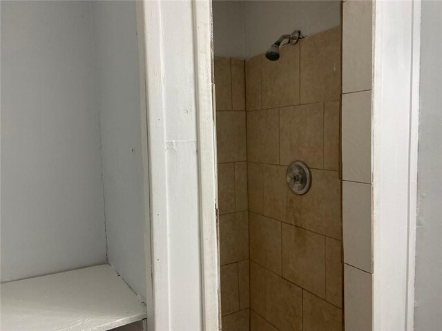 bathroom with tiled shower