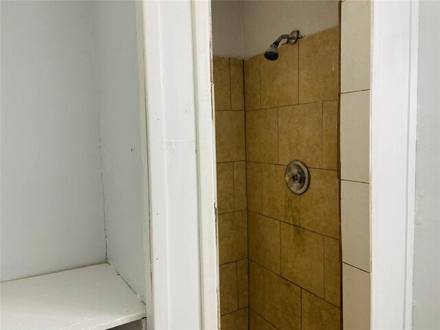 bathroom with tiled shower