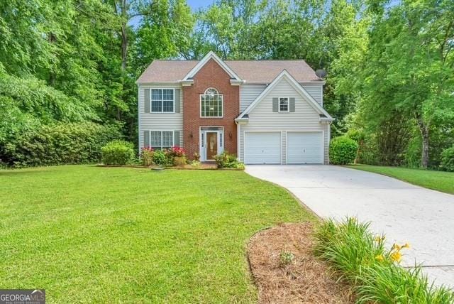 190 Crestworth Ct, Powder Springs, GA 30127 - colonial house with concrete driveway, a front lawn, an attached garage, and brick siding