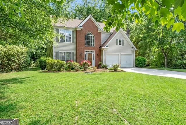 190 Crestworth Ct, Powder Springs, GA 30127 - view of front of house with driveway and a front yard