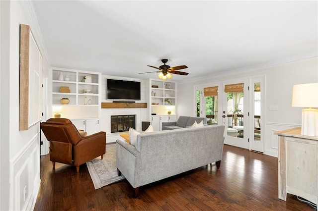 3710 Robinson Walk Ct, Marietta, GA 30068 - living area featuring ornamental molding, a fireplace, a ceiling fan, dark wood-style flooring, and french doors