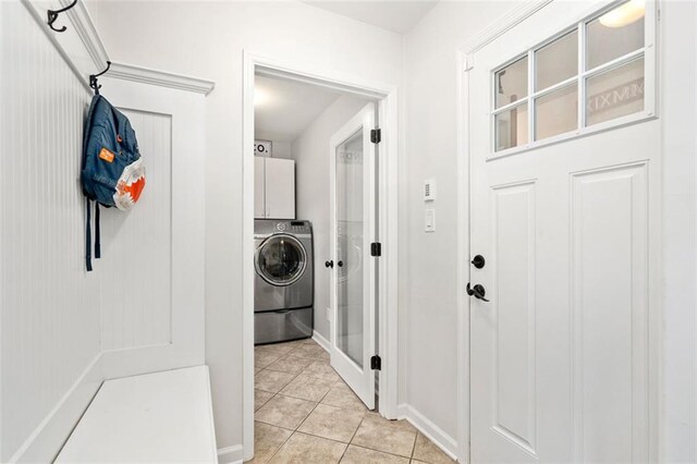 3710 Robinson Walk Ct, Marietta, GA 30068 - washroom featuring cabinet space, washer / dryer, light tile patterned flooring, and baseboards