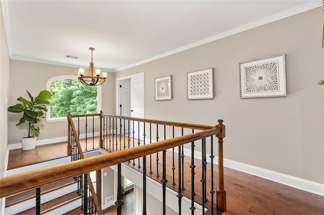 3710 Robinson Walk Ct, Marietta, GA 30068 - corridor featuring an upstairs landing, wood finished floors, baseboards, crown molding, and a chandelier