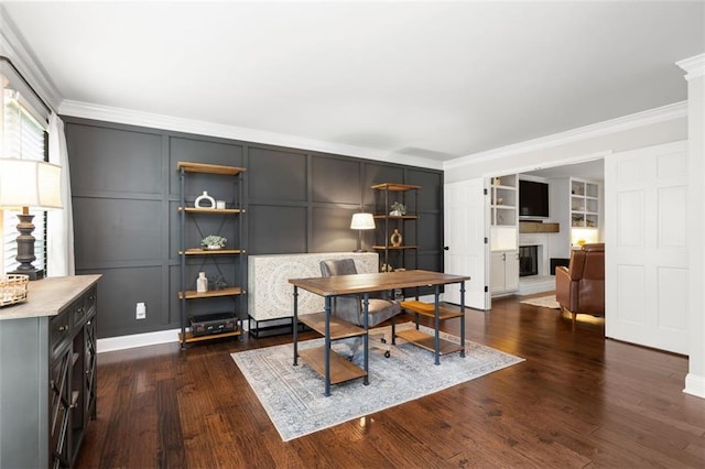 3710 Robinson Walk Ct, Marietta, GA 30068 - home office with crown molding, a decorative wall, a fireplace, and dark wood-style floors