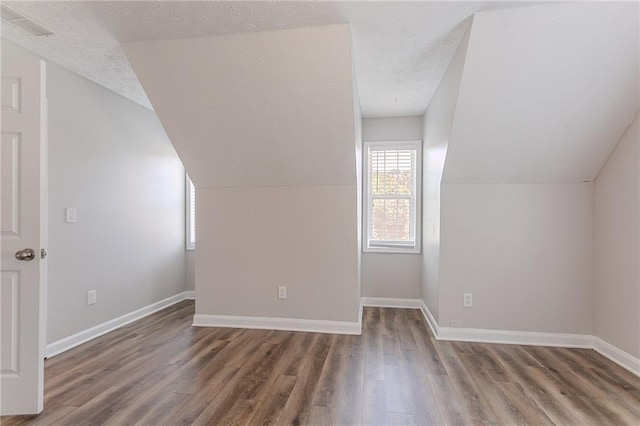 1797 Emerson Lake Cir, Snellville, GA 30078 - bonus room featuring wood finished floors, a textured ceiling, and lofted ceiling