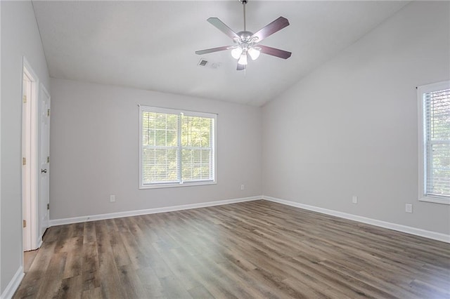 1797 Emerson Lake Cir, Snellville, GA 30078 - spare room with vaulted ceiling, plenty of natural light, wood finished floors, and ceiling fan