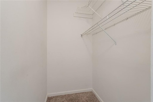 1797 Emerson Lake Cir, Snellville, GA 30078 - walk in closet featuring light colored carpet