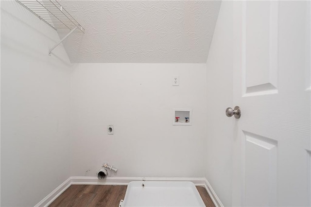 1797 Emerson Lake Cir, Snellville, GA 30078 - laundry room with hookup for a washing machine, dark wood-type flooring, gas dryer hookup, electric dryer hookup, and a textured ceiling