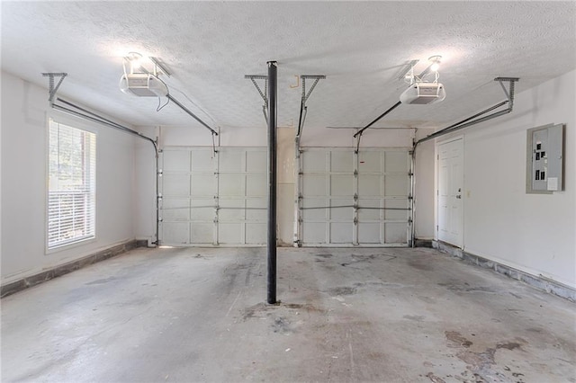 1797 Emerson Lake Cir, Snellville, GA 30078 - garage with a garage door opener and electric panel