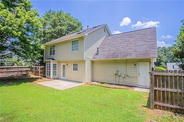 1797 Emerson Lake Cir, Snellville, GA 30078 - back of house with a fenced backyard, a shingled roof, and a patio