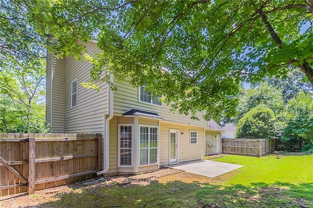 1797 Emerson Lake Cir, Snellville, GA 30078 - back of property with a patio area and a fenced backyard