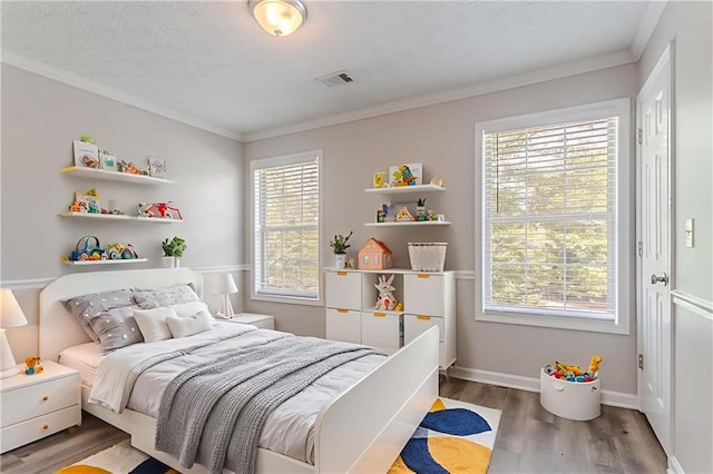 1797 Emerson Lake Cir, Snellville, GA 30078 - bedroom featuring wood finished floors and ornamental molding