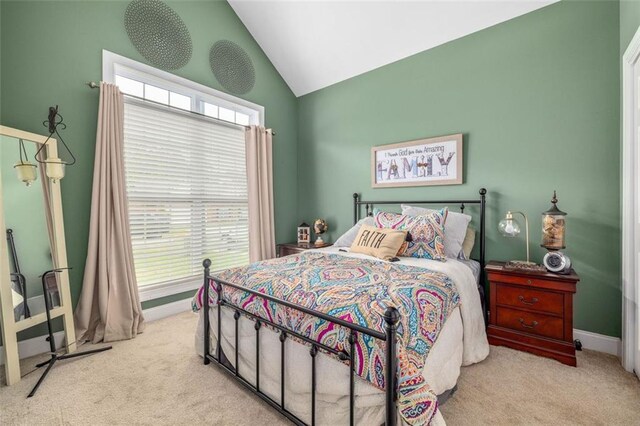 930 Brenau Point Dr, Gainesville, GA 30501 - bedroom with carpet flooring, vaulted ceiling, and baseboards