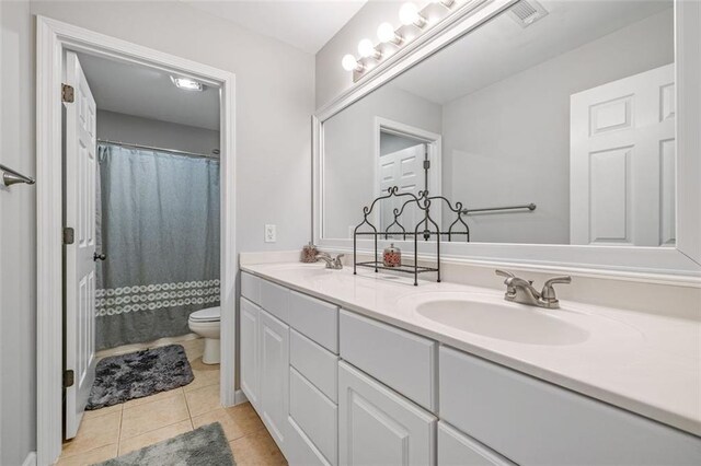 930 Brenau Point Dr, Gainesville, GA 30501 - full bathroom with toilet, tile patterned floors, double vanity, and a shower with shower curtain