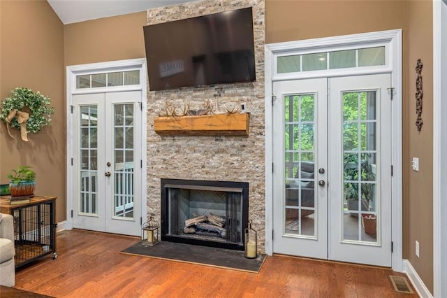 930 Brenau Point Dr, Gainesville, GA 30501 - doorway with french doors, wood finished floors, baseboards, and a fireplace