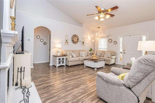 living room with ceiling fan, high vaulted ceiling, and hardwood / wood-style flooring