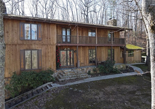 view of front of home with a balcony