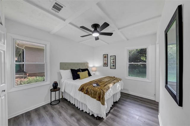 bedroom featuring ceiling fan, coffered ceiling, dark hardwood / wood-style flooring, and beam ceiling