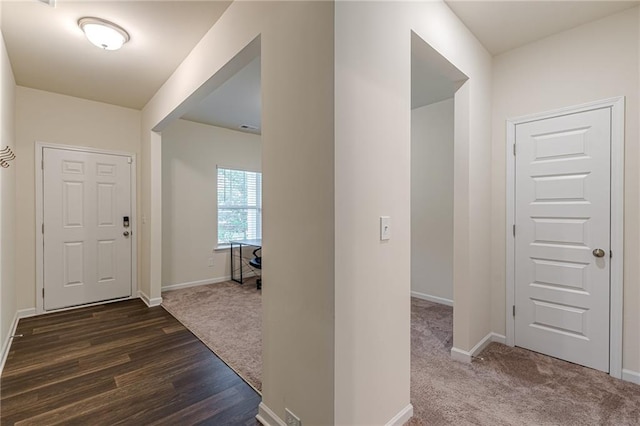 view of carpeted foyer