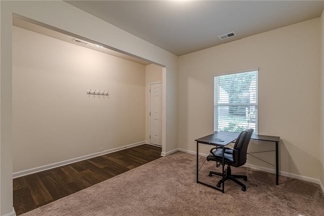 home office featuring dark carpet