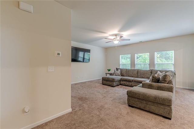 living room featuring ceiling fan and light carpet