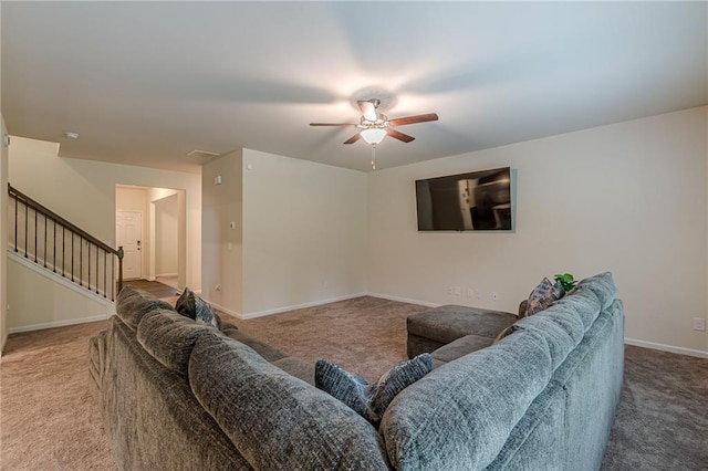 living room featuring carpet flooring and ceiling fan