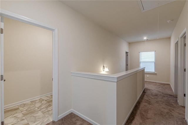 hall featuring light colored carpet