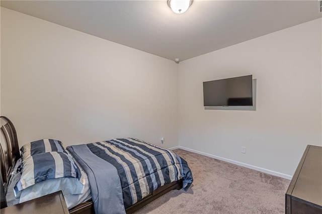 bedroom featuring light carpet