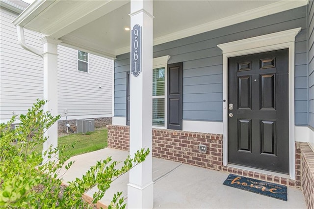 doorway to property featuring a porch