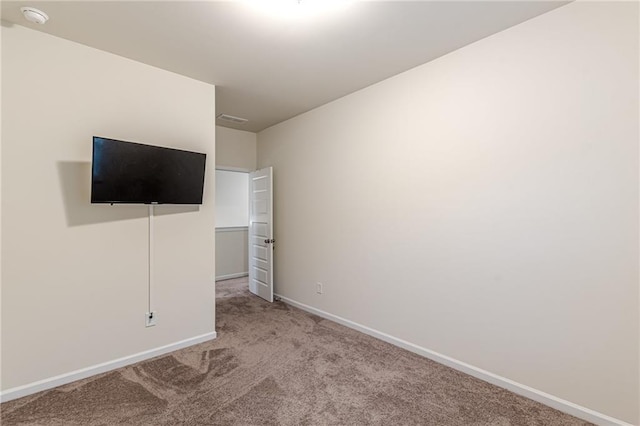 unfurnished bedroom with light carpet