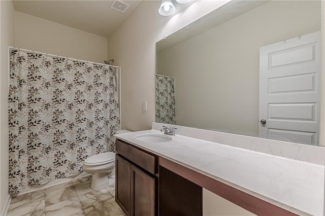 bathroom with curtained shower, vanity, and toilet