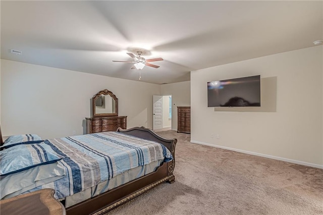 bedroom featuring ceiling fan and light colored carpet