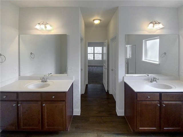 bathroom featuring vanity and hardwood / wood-style floors