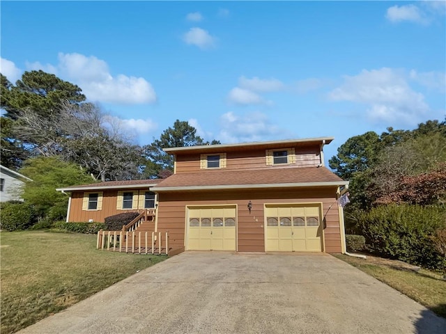 view of front of property featuring a garage and a front lawn