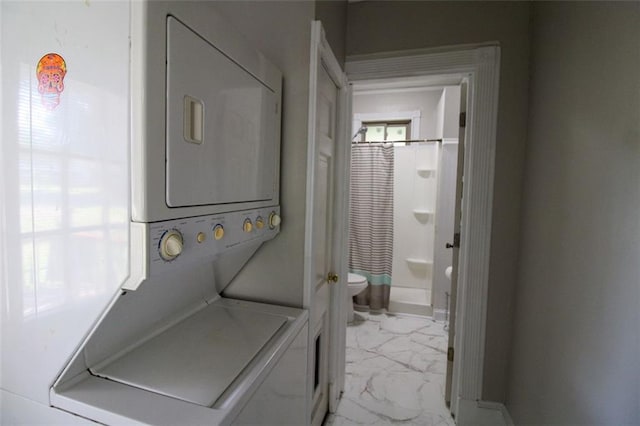 200 Litchfield St, Rockmart, GA 30153 - laundry area featuring stacked washer / dryer, light marble finish flooring, and healthy amount of natural light