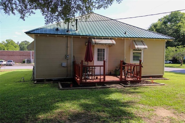 200 Litchfield St, Rockmart, GA 30153 - rear view of property with a deck, a lawn, and a metal roof