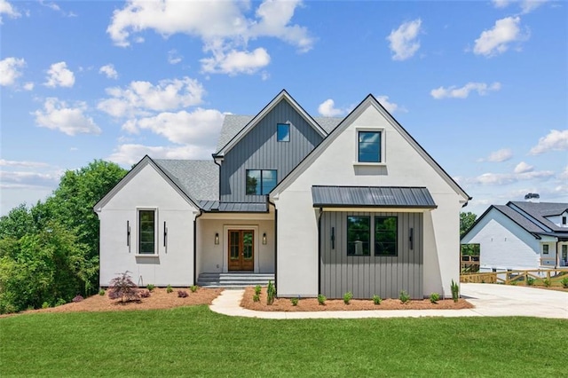 7188 Williams Rd, Flowery Branch, GA 30542 - modern farmhouse style home with a standing seam roof, a front lawn, metal roof, and stucco siding