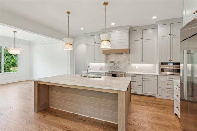 7188 Williams Rd, Flowery Branch, GA 30542 - kitchen featuring a sink, stainless steel appliances, backsplash, custom range hood, and decorative light fixtures